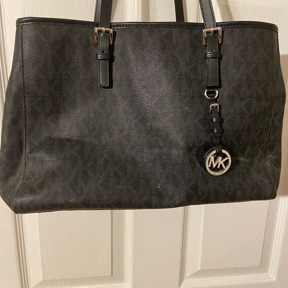 Michael Kors Black Monogram Tote
Preloved condition - Picture 12 of 12